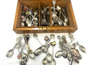 Large selection of assorted souvenir spoons