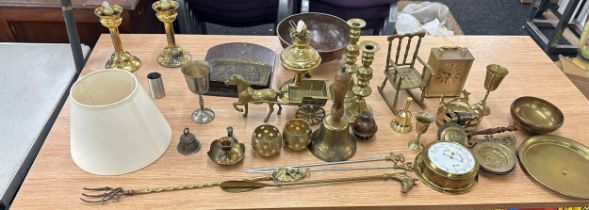 Large selection of assorted brass ware includes bells, candle stick etc