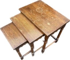 Oak nest of three tables largets measures approximately 19 inches tall