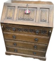 Old charm Oak 4 drawer bureau with panels measures approximately39 inches tall 29 inches wide 19