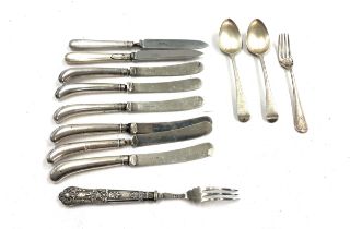 12 silver items includes spoons, knives, forks etc