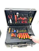 Large black case with an assortment of tools