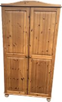 pine 2 door wardrobe measures approximately 71 inches tall