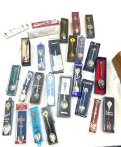 Large selection of boxed souvenir spoons
