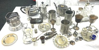 Large selection of metal ware includes tea pots, goblets, cruet set etc