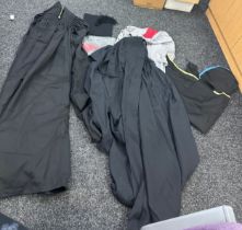 Selection of graduation gowns, hats etc