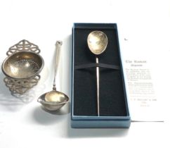 2 silver spoons and silver tea strainer