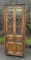 Vintage old charm corner cabinet with lights measures approximately 66 inches tall