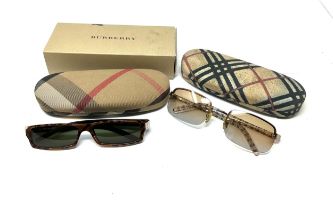 2 cased Burberry sunglasses Items are in previously owned condition Signs of age & wear
