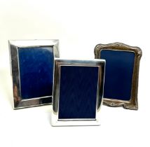 3 silver picture frames largest measures approx 18cm by 13.5cm