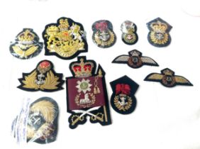 11 x different hand embroidered gold wire military cap badges/wings