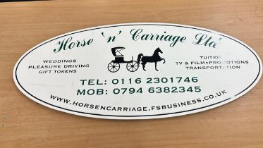 Advertising horse and carriage oval sign measures approximately 40 inches by 17 inches