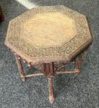 Walsh and co heavily carved Indian table measures approx 21 inches tall by 20 diameter