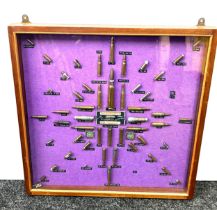 Cased diorama of various used shells / bullets and ammunition 62 cm by 61cm,