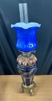 Royal Doulton oil lamp with gilded bronze mounts with glass shade and chimney height approximately