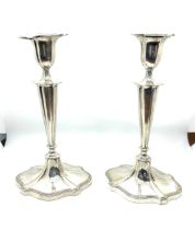 Pair of vintage walker and hall silver candle sticks, filled. 9.5 inches tall