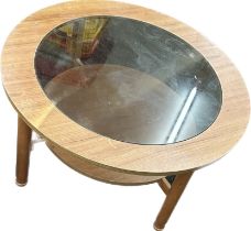 Retro glass topped round coffee table measures approximately 21 inches tall 24 inches wide 16 inches