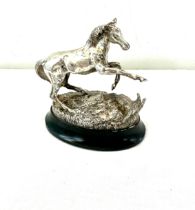 Lorne McKean. 'Playing up'; a silver model of a horse, London import marks for 1975 total weight