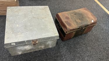 2 Large metal trunks measures approximately 25 inches square 14 inches tall