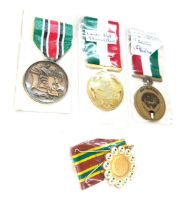Four medals for the Gulf war- Saudi Combat medal, Bahrain medal for liberation of Kuwait, Kuwait