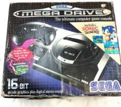 Boxed Sega mega drive includes sonic the hedgehog game in original box, untested