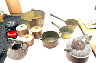 Large selection of vintage brass and copper pans, kettles etc