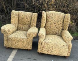 Antique upholstered his and hers fireside chairs