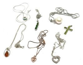 selection of silver pendant necklaces etc