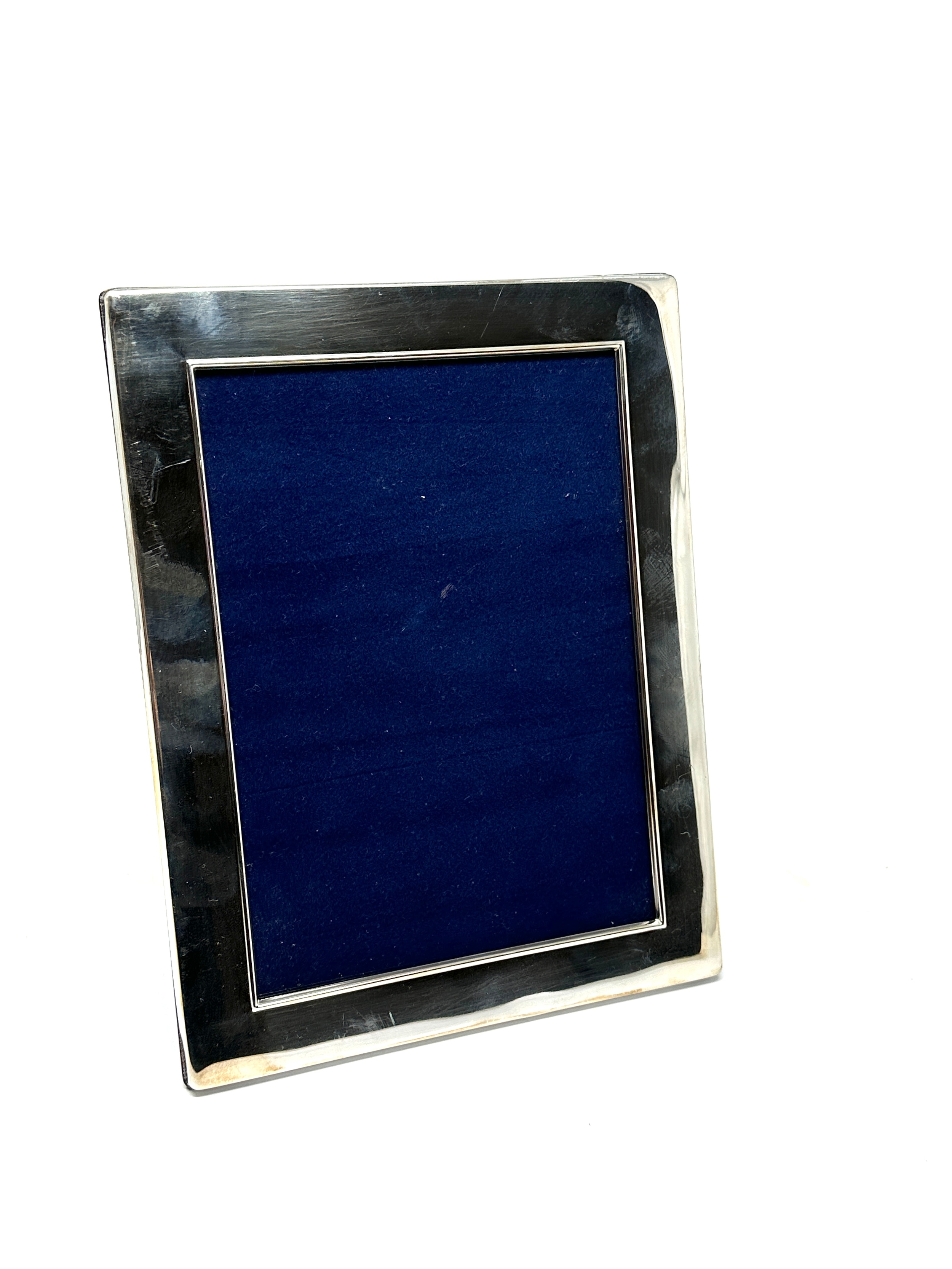 large silver picture frame measures approx 22cm by 17cm