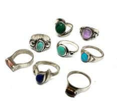 Eight silver stone set rings including turquoise and malachite (34g)