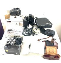 Selection of cameras and binoculars to include Tasco binoculars, Canon sure shot, etc all untested