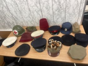 Large selection of vintage and later hats and helmets