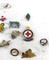 Selection of enamel badges and pins to include British red cross etc