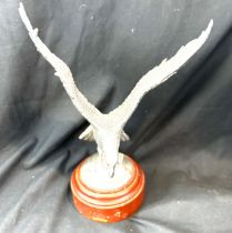 Silver plated eagle mounted on a wooden base height 9 inches tall