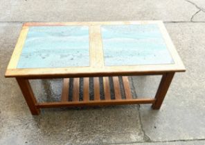Retro oak and slate coffee table measures approximately 18 onches tall 39 inches wide 20 inches