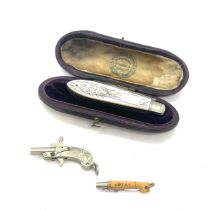 Silver cased pocket knife complete with antique miniature gun