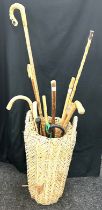 Selection of walking sticks and a walking stick stand
