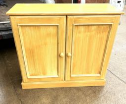 2 door large wooden cupboard measures approximately 40 inches tall 45 inches wide 15 inches depth