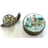 Small oriental metal snail and a mirrored trinket