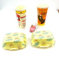 Selection of vintage mcdonalds memorabilia includes cups, mc chicken boxes and a toy