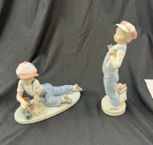 Lladro boy with train, Lladro boy with harmonica both in good overall condition