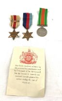 Selection of military WW2 medals HG Brown 1939-45 star, African star and bar defensive medal -