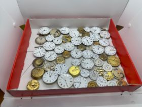 Large selection of antique pocket watch movements for spares/repairs