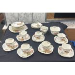 Standard china part tea service to include cups, saucers, sugar bowl etc