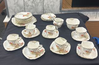 Standard china part tea service to include cups, saucers, sugar bowl etc