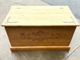 Pine carved blanket/ toy box measures apprdoximately 20 inches tall 36 inches wide 21 inches depth