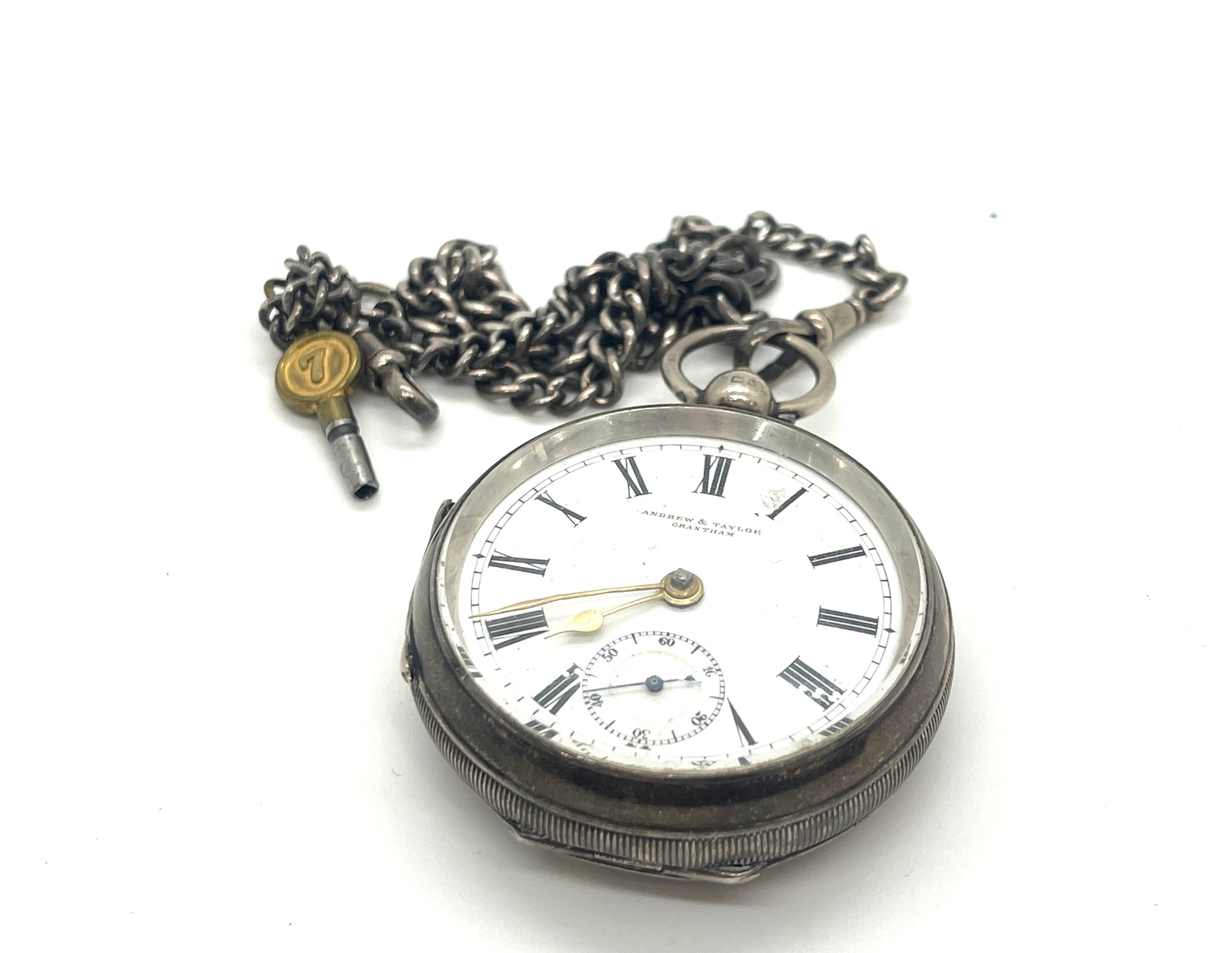 Sterling silver pocket watch and chain watch marked Andrew and Taylor Grantham, untested
