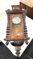 Vintage mahogany 2 key hole Vienna wall clock with pendulum and key measures approx 33 inches long