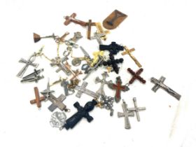 Approximately 35 antique and vintage religious crucifix and cross pendants etc
