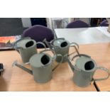 4 grey watering cans